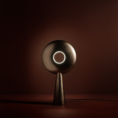 Rondo Table Lamp in aged brass, lit, Studio Baldo
