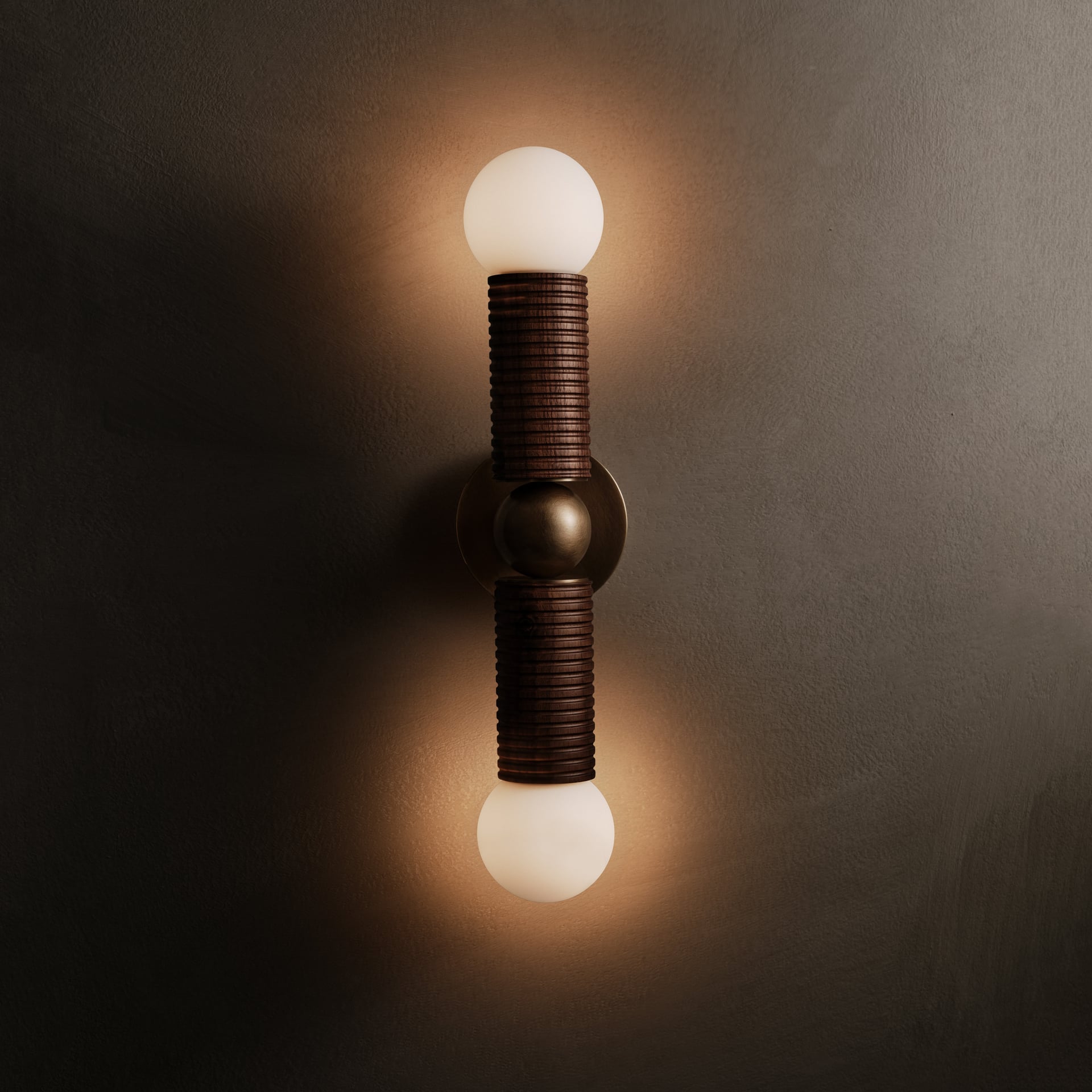 Axis Wall Sconce in walnut and aged brass, lit, Studio Baldo