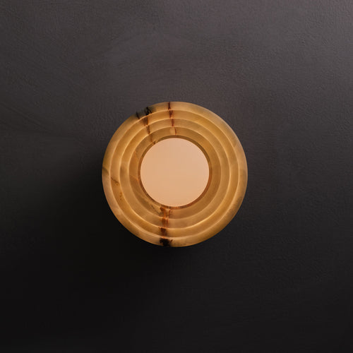 Bruma Wall Sconce in Green Onyx and aged brass, lit, Studio Baldo