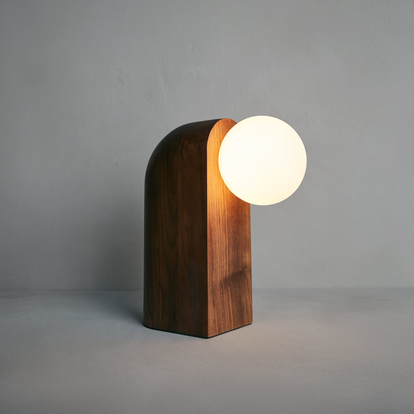 Nono Table Lamp in walnut, angled view, Studio Baldo