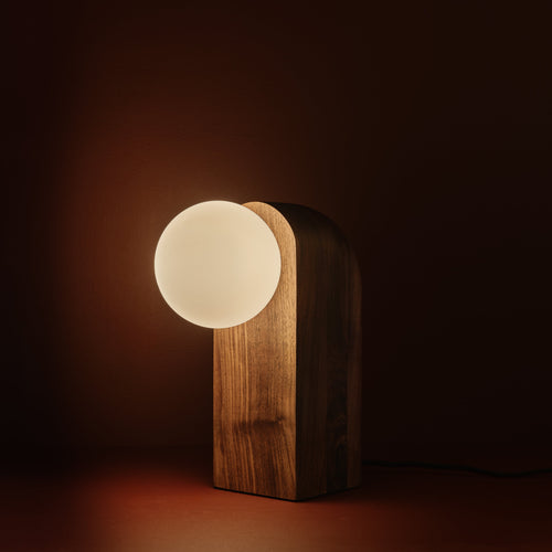 Nono Table Lamp in walnut, lit, Studio Baldo