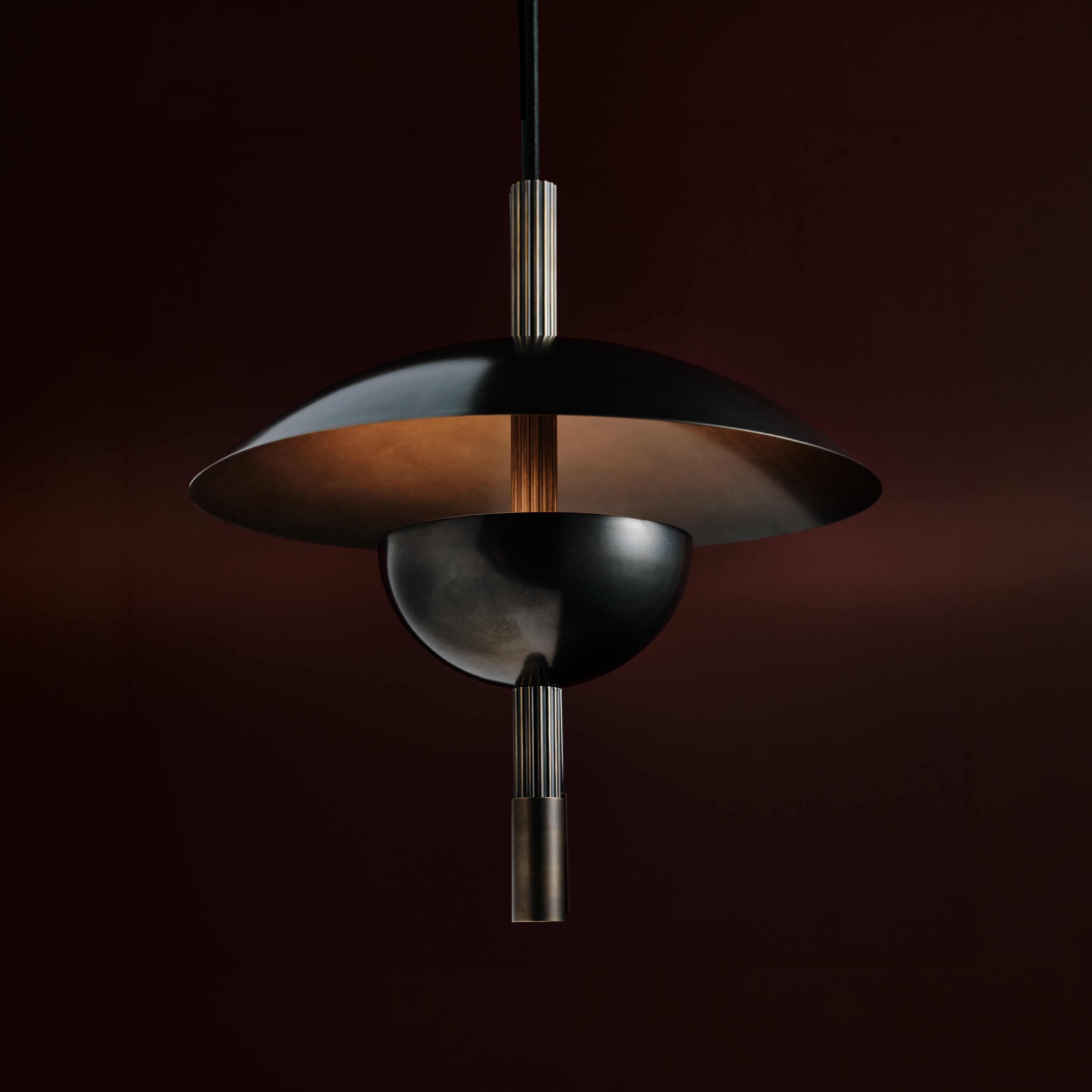 Orbit Ceiling Pendant in blackened brass, angled view, Studio Baldo